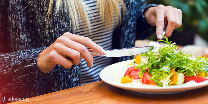 Person Eating Vegetables